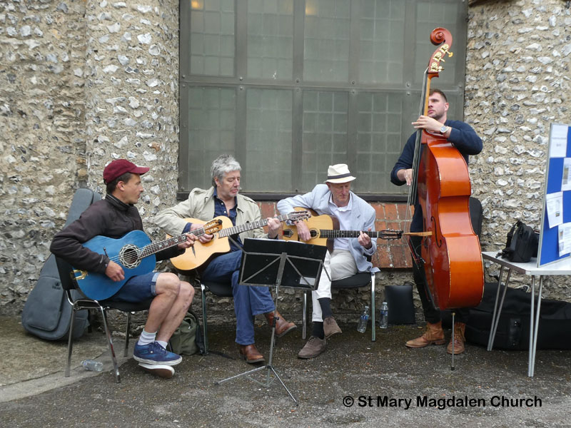 Musicians playing by Church Hall door