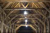 Tithe Barn at Falmer interior roof beams in June 2021