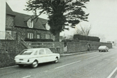 Falmer village showing the flint and brick cottages on the pond side of the village, from the main road