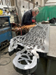 Cutting the metal sheets to make the sculptures
