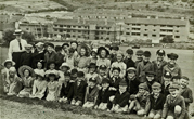 1953 Mrs Hemsley with class Bates Estate in background