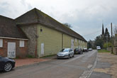 2011 Stanmer Village Weather Boarded Barn on the left and church in background