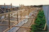 Frames for first 6 houses in place March or April 1998