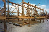 Frames for first 6 houses in place March or April 1998