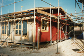 View of a house partly painted January 1999