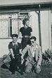 Brian and his best man and Brian's mother and the dog outside the prefab 8/8/1953