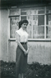 Brian's wife outside the prefab in the back garden