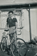 Brian aged about 13 with his bicycle outside the prefab 8/8/1953