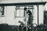 Brian in the garden of the prefab with his bicycle 8/8/1953