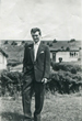 Brian in the front garden with another prefab behind