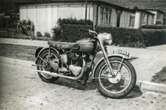 Brian's second motorbike on the road outside no. 47 Heath Hill Ave, prefabs in background