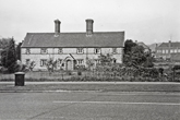 1954 Three cottages occupied by workers on Coldean Farm. Buildings in background from 1920s-30s.