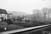 Lewes Road as it approaches the junction with Coldean Lane, showing the northern end of the terraced Coldean Lane Cottages. The two separate detached houses were always treated as part of the Cottages.