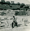 Brian Donaldson sitting on a pile of bricks